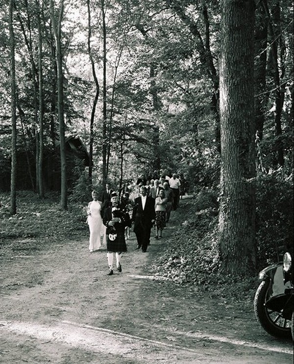 Leading the wedding party through the woods